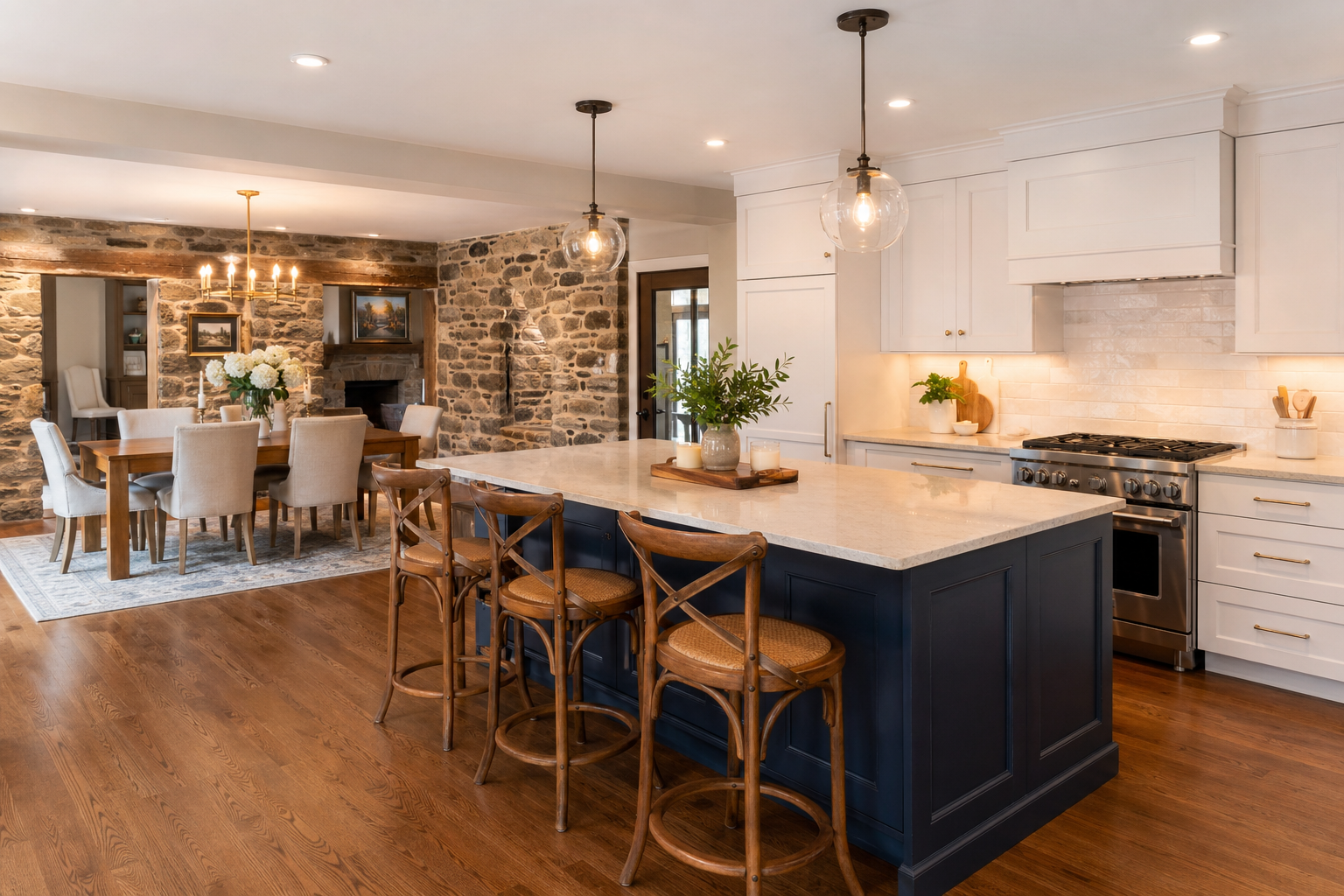 Finished open concept kitchen and dining area renovation in a Chester County PA stone home with navy island