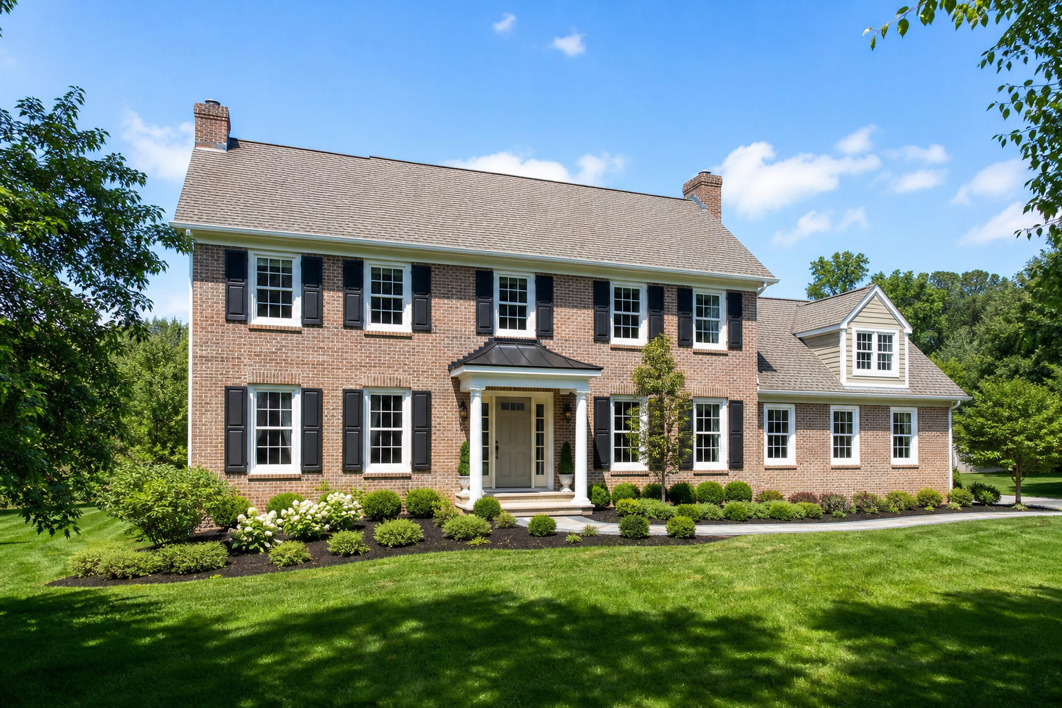 Window replacement Chester County PA — colonial home exterior with newly installed windows